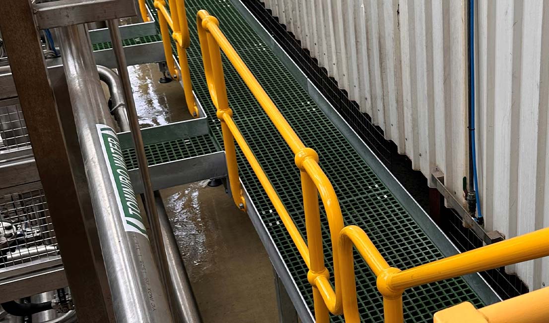 metal fabricated yellow walkway for milk facility